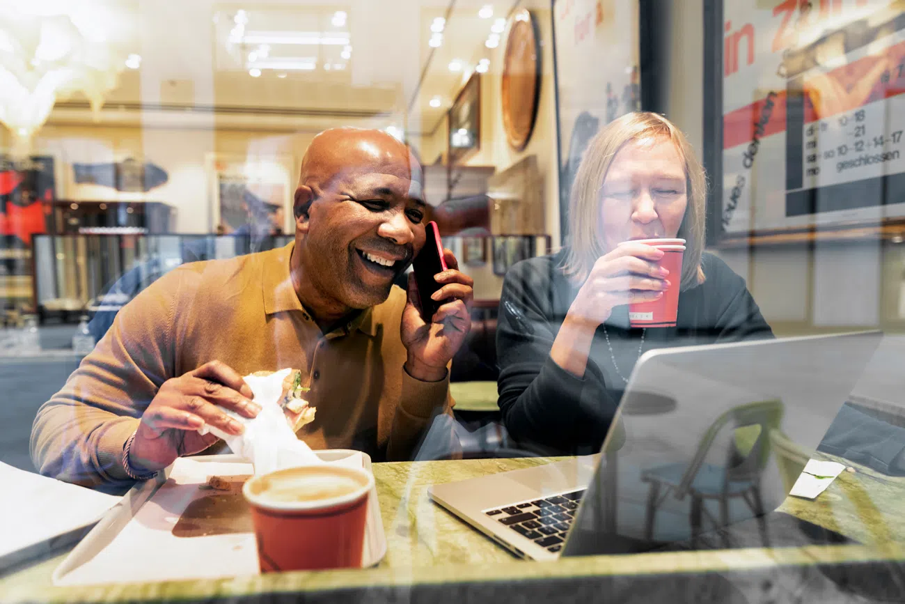 Cafe visitors using VPN router on public Wi-Fi to prevent data leaks